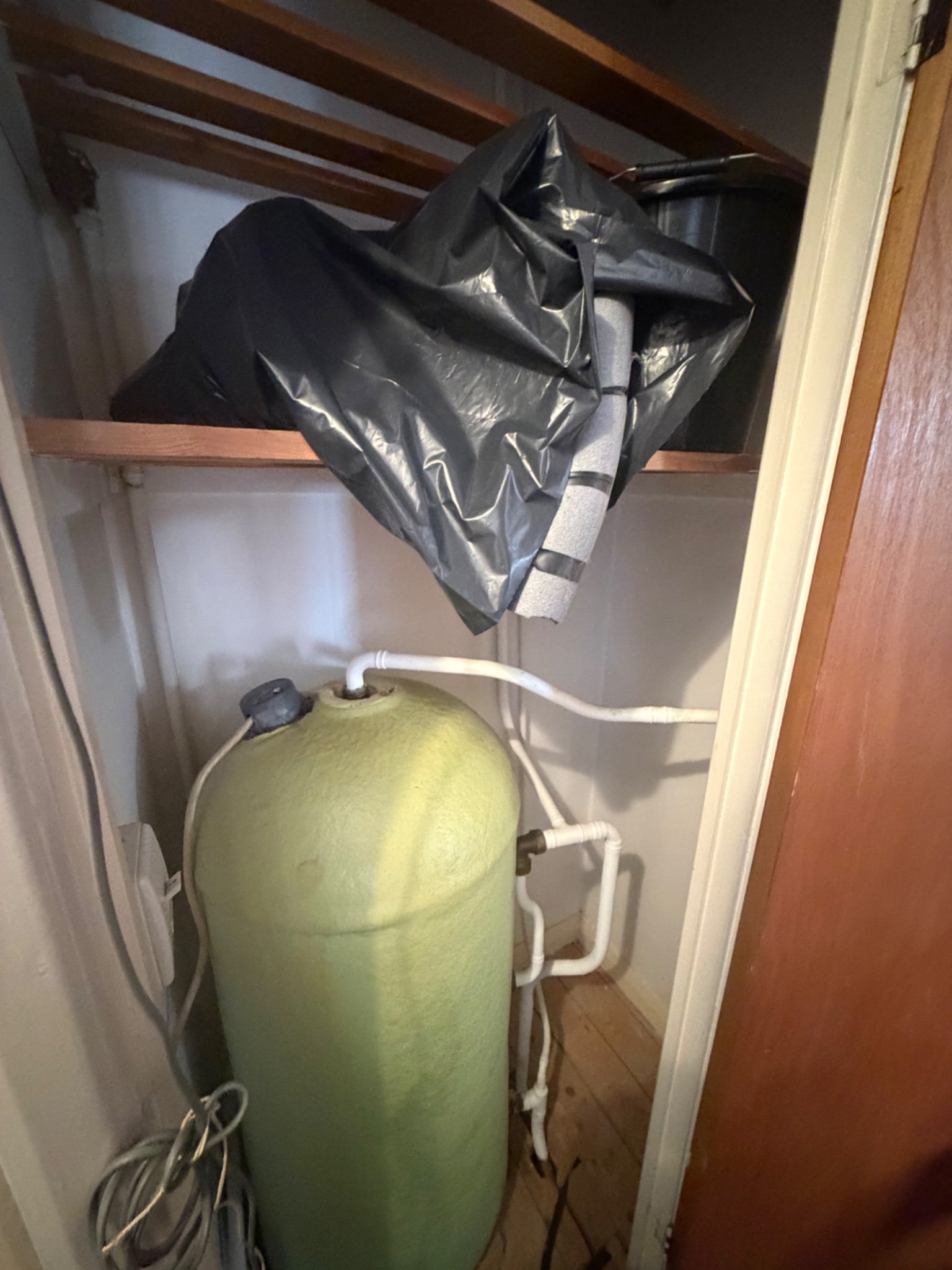 The old hot water cylinder in the airing cupboard before the combi boiler was installed, Darlington